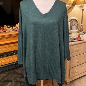 Tunic sweater with ribbed detail.